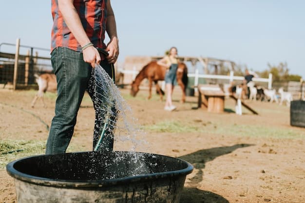 Farmer drawing clean water from a completed HydroDrill Experts borehole