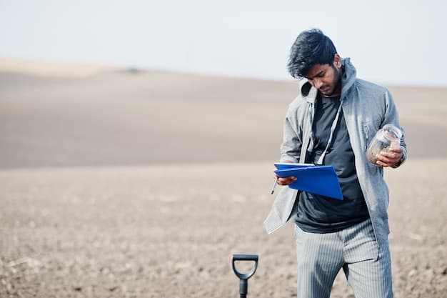 Specialist inspecting ground conditions during a site survey